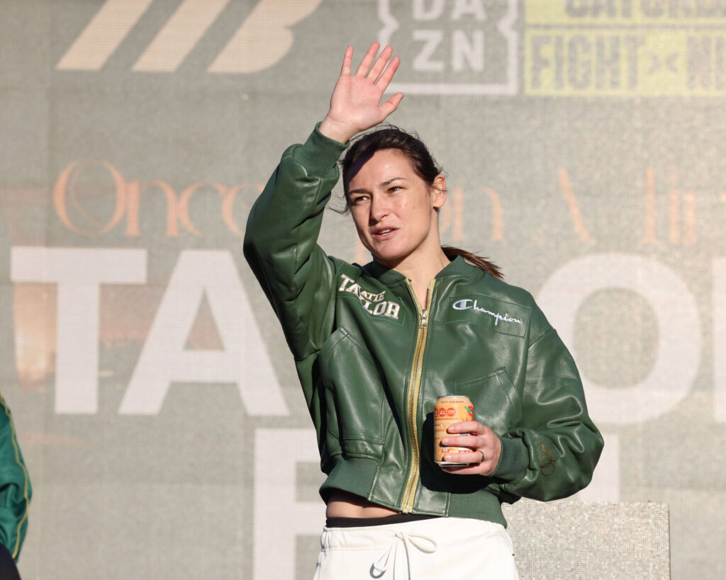Katie Taylor waves to fans at her final weigh-in ahead of her retirement fight against Flora Pili at Croke Park, Dublin